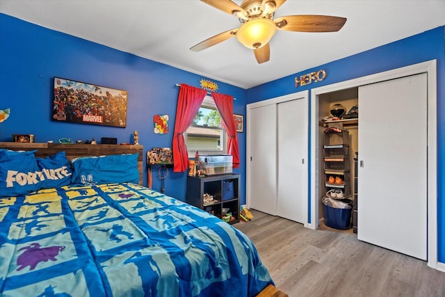 3433 Illinois St, Mount Pleasant, WI 53405 - bedroom featuring multiple closets, wood finished floors, a ceiling fan, and cooling unit