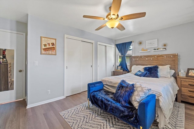 3433 Illinois St, Mount Pleasant, WI 53405 - bedroom with multiple closets, wood finished floors, a ceiling fan, and baseboards