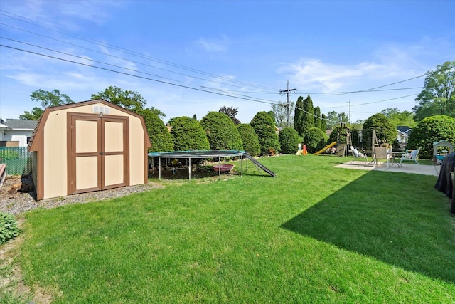 3433 Illinois St, Mount Pleasant, WI 53405 - view of green lawn featuring a trampoline and a playground