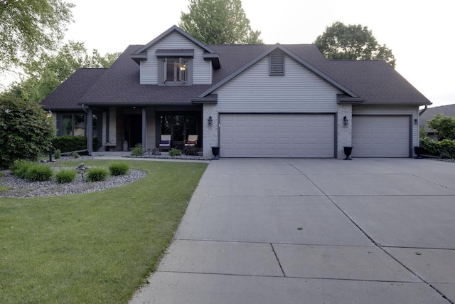 396 Panther Ct, Whitewater, WI 53190 - view of front of home featuring an attached garage, driveway, a front lawn, roof with shingles, and brick siding