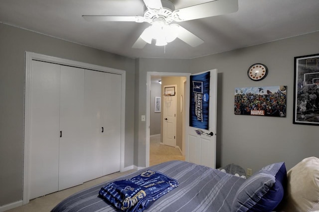 396 Panther Ct, Whitewater, WI 53190 - bedroom featuring a closet, light colored carpet, a ceiling fan, and baseboards