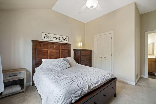 1820 Stoney Ln, Slinger, WI 53086 - bedroom featuring lofted ceiling, light carpet, baseboards, a ceiling fan, and a closet