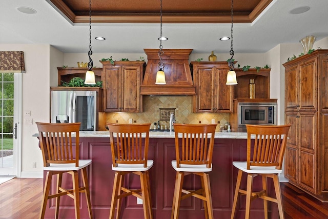 4205 Quarry Springs Dr, Racine, WI 53405 - kitchen featuring stainless steel appliances, a raised ceiling, dark wood-type flooring, recessed lighting, and crown molding