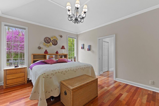 4205 Quarry Springs Dr, Racine, WI 53405 - bedroom featuring a chandelier, baseboards, light wood-style flooring, and ornamental molding