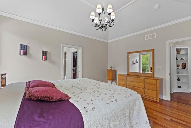 4205 Quarry Springs Dr, Racine, WI 53405 - bedroom featuring a chandelier, crown molding, wood finished floors, a walk in closet, and baseboards