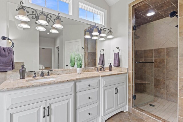 4205 Quarry Springs Dr, Racine, WI 53405 - bathroom with double vanity, a stall shower, and tile patterned flooring