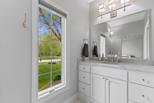 4205 Quarry Springs Dr, Racine, WI 53405 - bathroom with vanity, baseboards, and tile patterned flooring