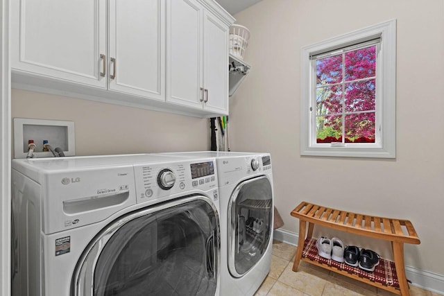 4205 Quarry Springs Dr, Racine, WI 53405 - laundry area with independent washer and dryer, cabinet space, baseboards, and light tile patterned floors