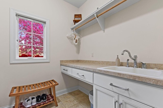 4205 Quarry Springs Dr, Racine, WI 53405 - washroom featuring a sink and light tile patterned floors