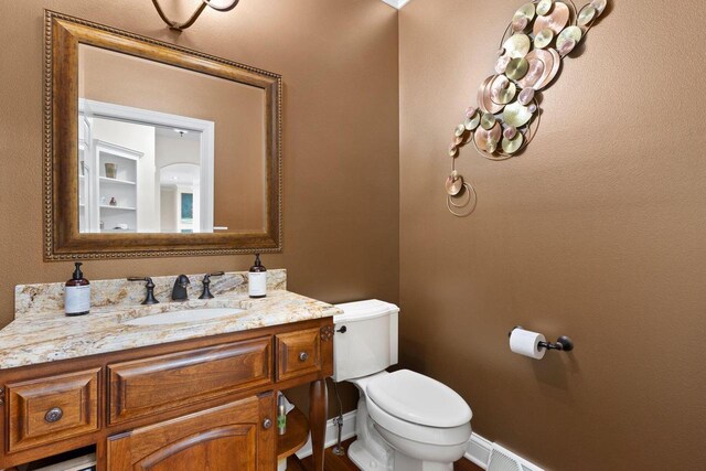 4205 Quarry Springs Dr, Racine, WI 53405 - bathroom featuring toilet, vanity, and baseboards