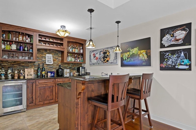 4205 Quarry Springs Dr, Racine, WI 53405 - indoor dry bar featuring beverage cooler, backsplash, and decorative light fixtures