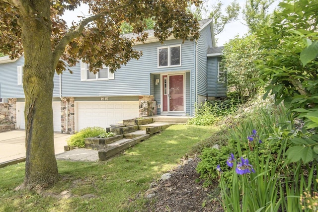 1915 Bonnie Ln, Waukesha, WI 53188 - view of front facade with a garage and stone siding