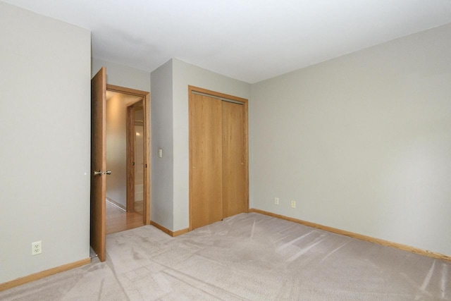 1915 Bonnie Ln, Waukesha, WI 53188 - unfurnished bedroom with light carpet, a closet, and baseboards