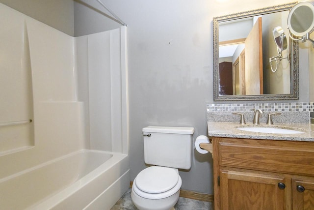 1915 Bonnie Ln, Waukesha, WI 53188 - bathroom featuring vanity, toilet, baseboards, backsplash, and shower / washtub combination