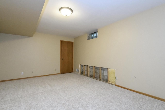 1915 Bonnie Ln, Waukesha, WI 53188 - empty room with carpet flooring, baseboards, and a fireplace