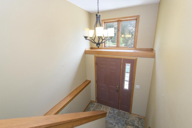 1915 Bonnie Ln, Waukesha, WI 53188 - foyer entrance featuring a chandelier and stone finish floors