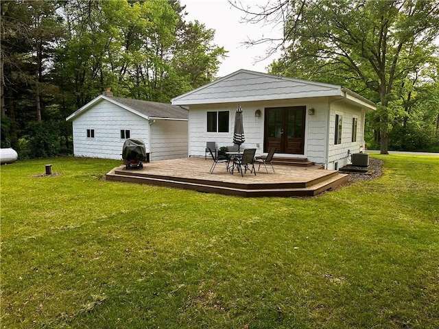 20454 70th Ave, Chippewa Falls, WI 54729 - rear view of house with french doors, a wooden deck, and a lawn