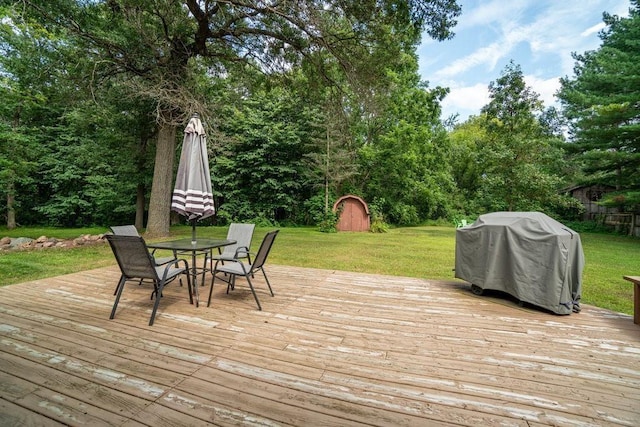 20454 70th Ave, Chippewa Falls, WI 54729 - deck with area for grilling, a yard, and outdoor dining area