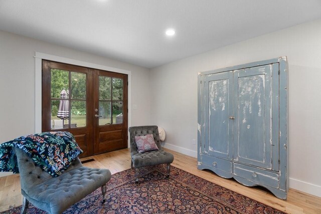 20454 70th Ave, Chippewa Falls, WI 54729 - sitting room with french doors, light wood-style flooring, baseboards, and recessed lighting