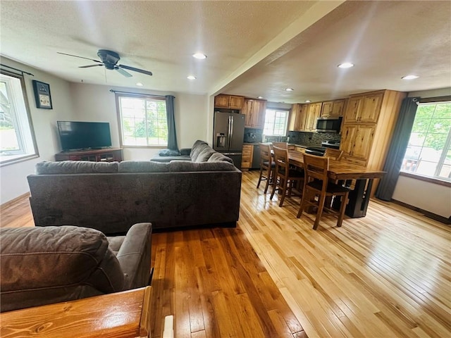 W14440 Culver Ave, Weyerhaeuser, WI 54895 - living room with light wood finished floors, ceiling fan, recessed lighting, and baseboards