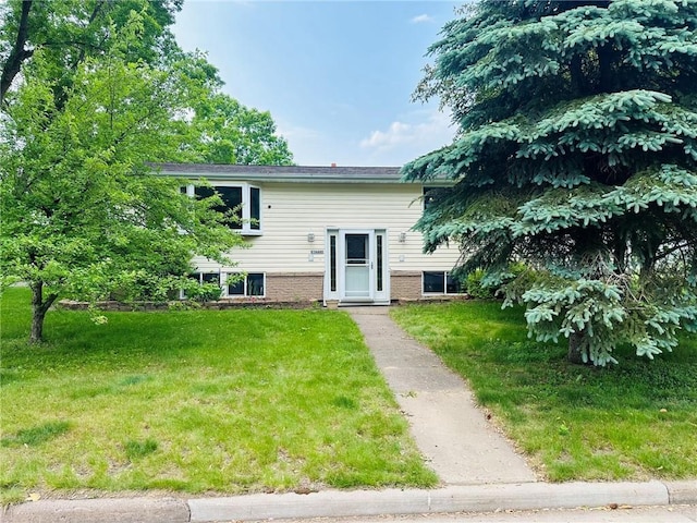W14440 Culver Ave, Weyerhaeuser, WI 54895 - bi-level home with a front lawn and brick siding