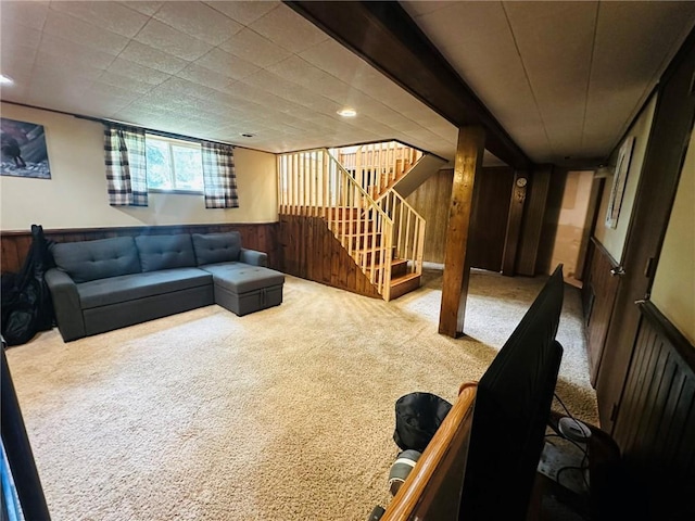 W14440 Culver Ave, Weyerhaeuser, WI 54895 - carpeted living area featuring wooden walls, stairs, and a wainscoted wall