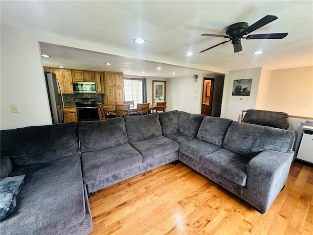 W14440 Culver Ave, Weyerhaeuser, WI 54895 - living area with recessed lighting, light wood-type flooring, a ceiling fan, and a textured ceiling