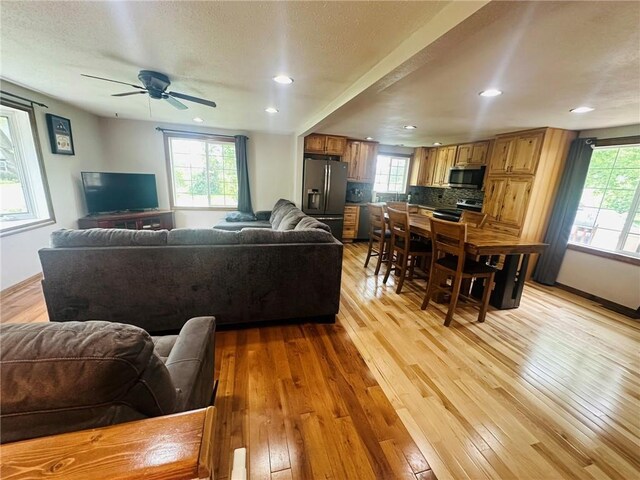W14440 Culver Ave, Weyerhaeuser, WI 54895 - living room with light wood finished floors, ceiling fan, recessed lighting, and baseboards