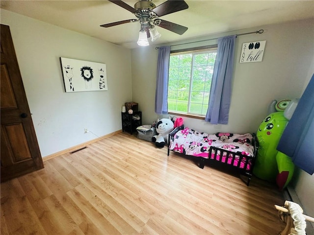 W14440 Culver Ave, Weyerhaeuser, WI 54895 - bedroom featuring wood finished floors, a ceiling fan, and baseboards