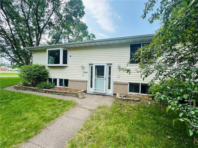 W14440 Culver Ave, Weyerhaeuser, WI 54895 - view of front facade featuring a front lawn and brick siding