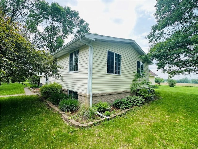 W14440 Culver Ave, Weyerhaeuser, WI 54895 - view of side of property featuring a yard