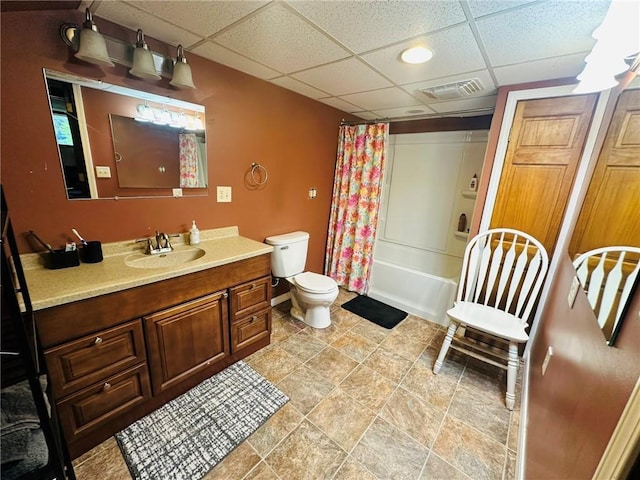 W14440 Culver Ave, Weyerhaeuser, WI 54895 - bathroom featuring vanity, toilet, a drop ceiling, and shower / bath combo with shower curtain