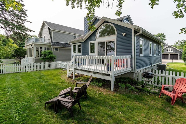 5230 Harbor Ct, Madison, WI 53705 - rear view of property featuring a wooden deck, a chimney, and a fenced backyard