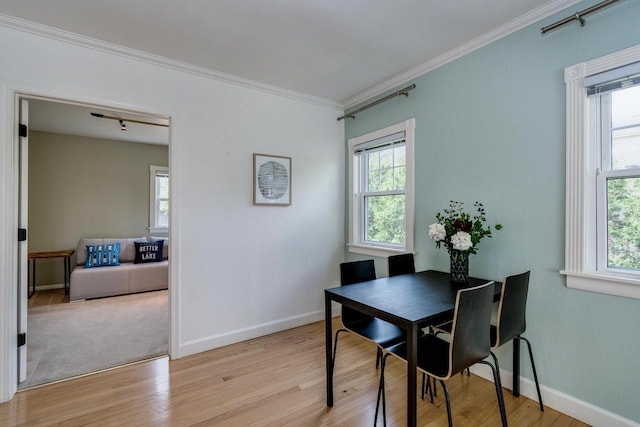 5230 Harbor Ct, Madison, WI 53705 - dining area featuring light wood-type flooring, healthy amount of natural light, and crown molding