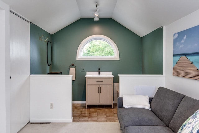 5230 Harbor Ct, Madison, WI 53705 - bathroom featuring vanity and vaulted ceiling