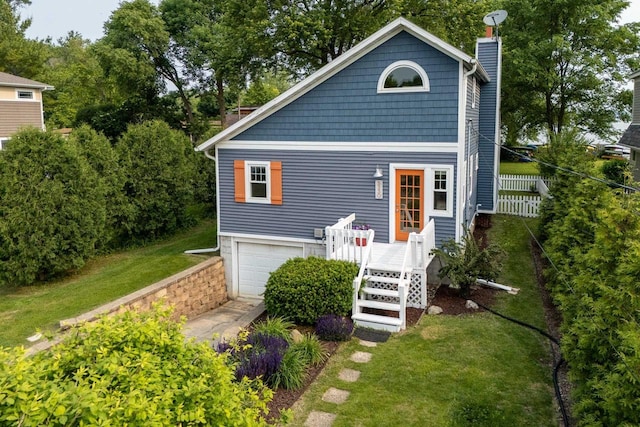 5230 Harbor Ct, Madison, WI 53705 - view of front of house with a chimney, an attached garage, and a wooden deck