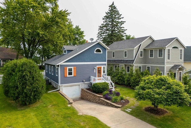 5230 Harbor Ct, Madison, WI 53705 - shingle-style home featuring an attached garage, concrete driveway, a front lawn, and a shingled roof