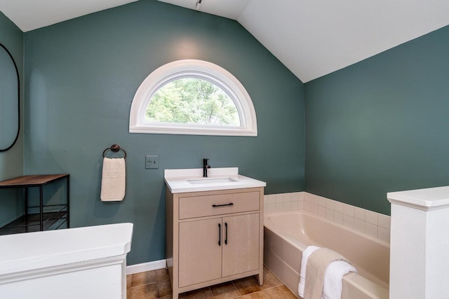 5230 Harbor Ct, Madison, WI 53705 - full bathroom featuring a garden tub, vaulted ceiling, and vanity