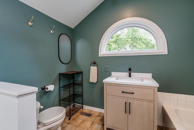 5230 Harbor Ct, Madison, WI 53705 - bathroom featuring lofted ceiling, a garden tub, vanity, and tile patterned flooring