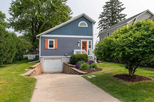 5230 Harbor Ct, Madison, WI 53705 - view of front facade with a front yard, driveway, and an attached garage