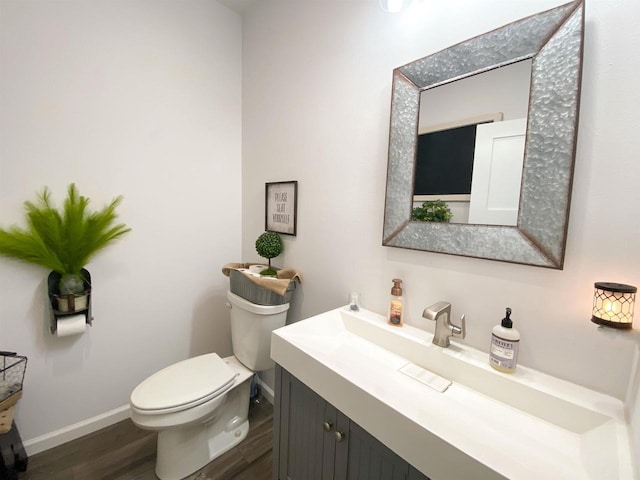110 Grand St, Highland, WI 53543 - bathroom with vanity, wood finished floors, toilet, and baseboards