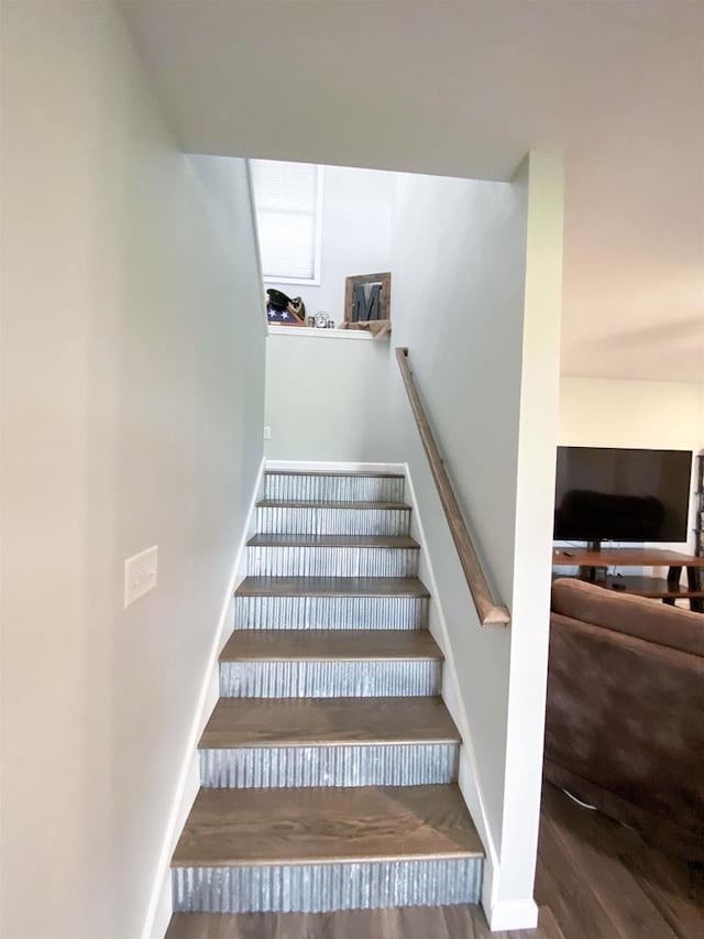 110 Grand St, Highland, WI 53543 - stairs with wood finished floors and baseboards