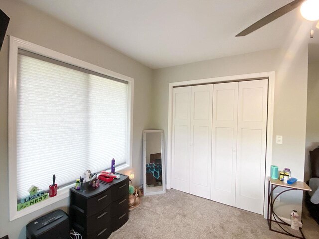 110 Grand St, Highland, WI 53543 - bedroom featuring light carpet, ceiling fan, and a closet