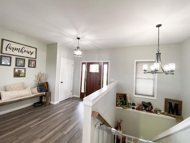 110 Grand St, Highland, WI 53543 - foyer entrance featuring a chandelier, dark wood-style flooring, and baseboards