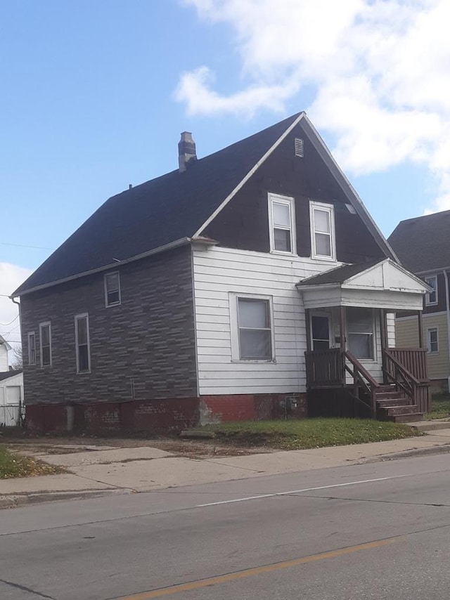 2468 N 35th St, Milwaukee, WI 53210 - view of front of home featuring a chimney and a porch