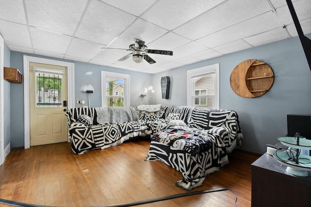 324 N Lincoln Ave, Beaver Dam, WI 53916 - living area with wood-type flooring, a drop ceiling, and a ceiling fan