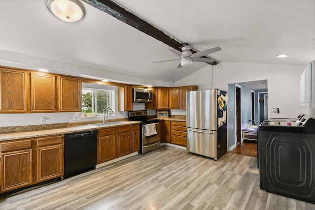 324 N Lincoln Ave, Beaver Dam, WI 53916 - kitchen featuring stainless steel appliances, brown cabinetry, lofted ceiling, a ceiling fan, and light countertops