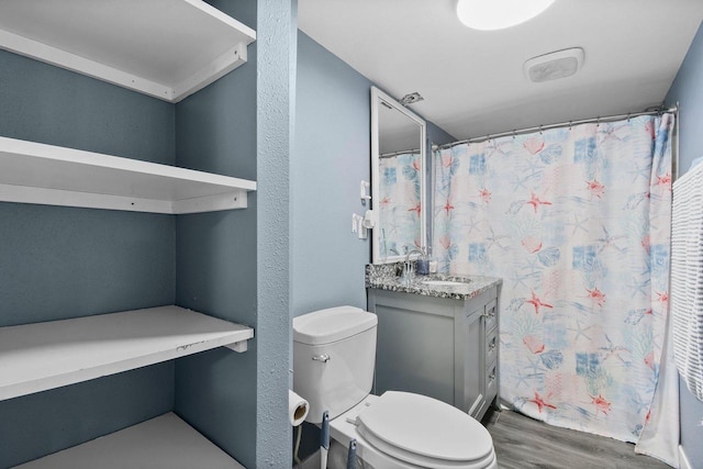 324 N Lincoln Ave, Beaver Dam, WI 53916 - full bathroom with wood finished floors, vanity, and a shower with curtain
