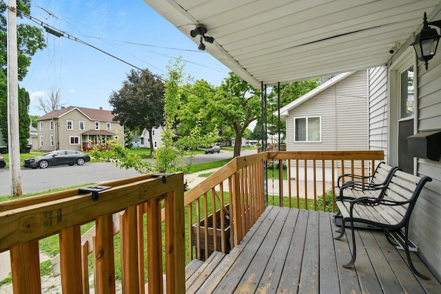 324 N Lincoln Ave, Beaver Dam, WI 53916 - wooden porch featuring a residential view