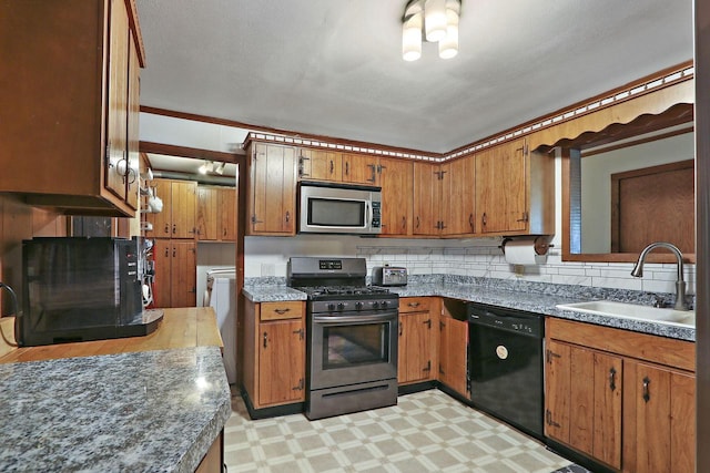 2518 Borg Rd, Delavan, WI 53115 - kitchen with appliances with stainless steel finishes, a sink, brown cabinets, light floors, and decorative backsplash